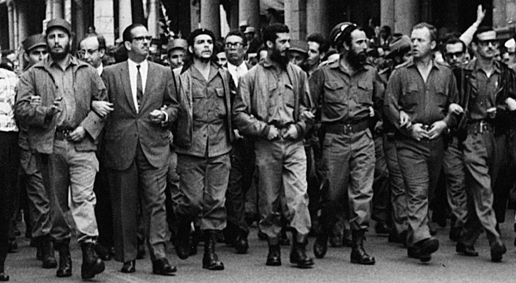 Fidel Castro and Che Guevara marching through Havana